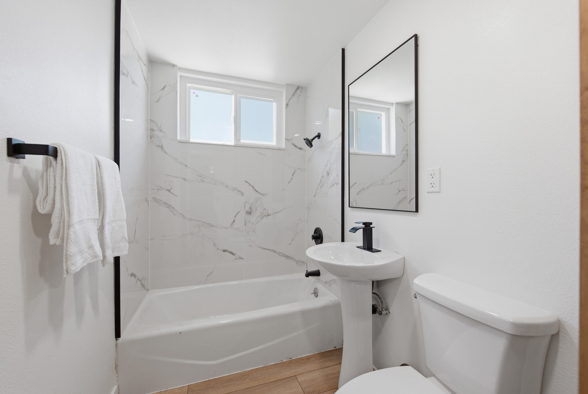 Hallway bath with shower over tub